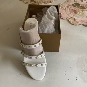 Charter Club white sandals with pearl detail.